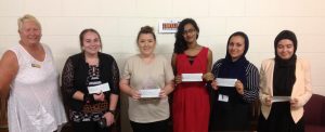 Club President Jo presenting the cheques